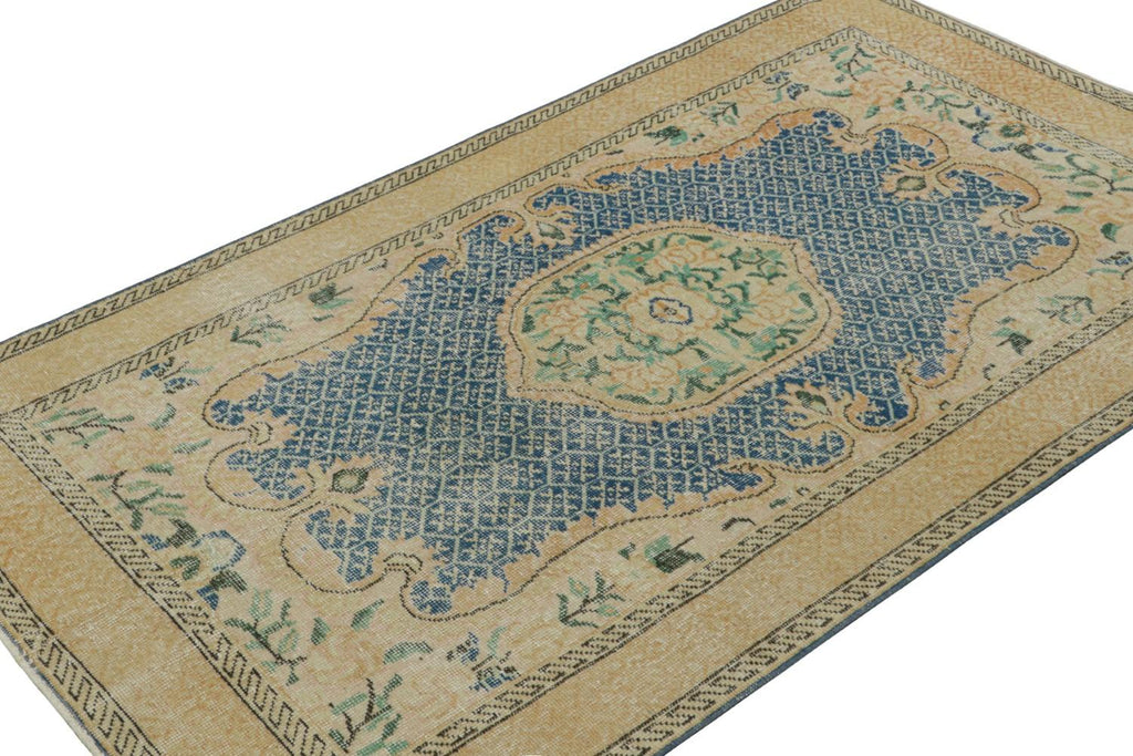 Vintage Turkish Rug With Gold Medallion And Blue Open Field