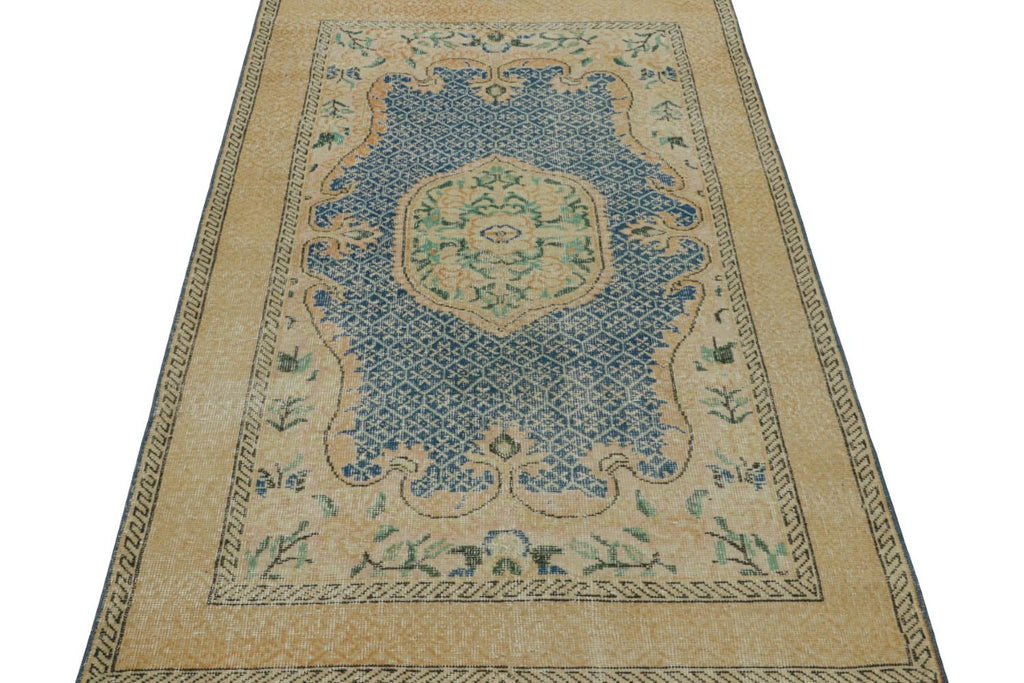 Vintage Turkish Rug With Gold Medallion And Blue Open Field