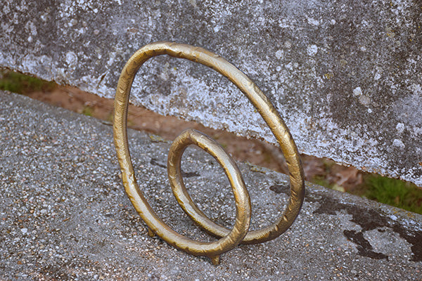 Rounded Metal Loop Sculpture In Textured Brass