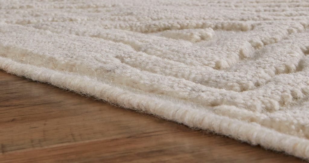 Norah Modern Solid Ivory Area Rug (5'6" x 8'6")